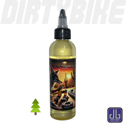 Apogee Performance chain lube, pine scent, amber fluid in clear squeeze bottle with black twist-cap nozzle and desert-scene label