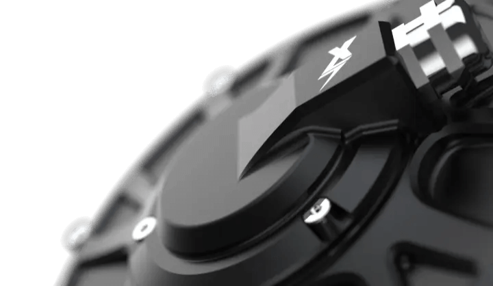 EBMX XTA-60 Talaria motor, matte black machined housing with hex bolts and embossed lightning-bolt logo, close-up angled detail