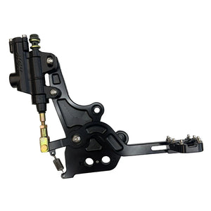 Black Sur-Ron Light Bee foot-brake unit fully assembled with pedal, master cylinder, toe peg, return spring and bolts