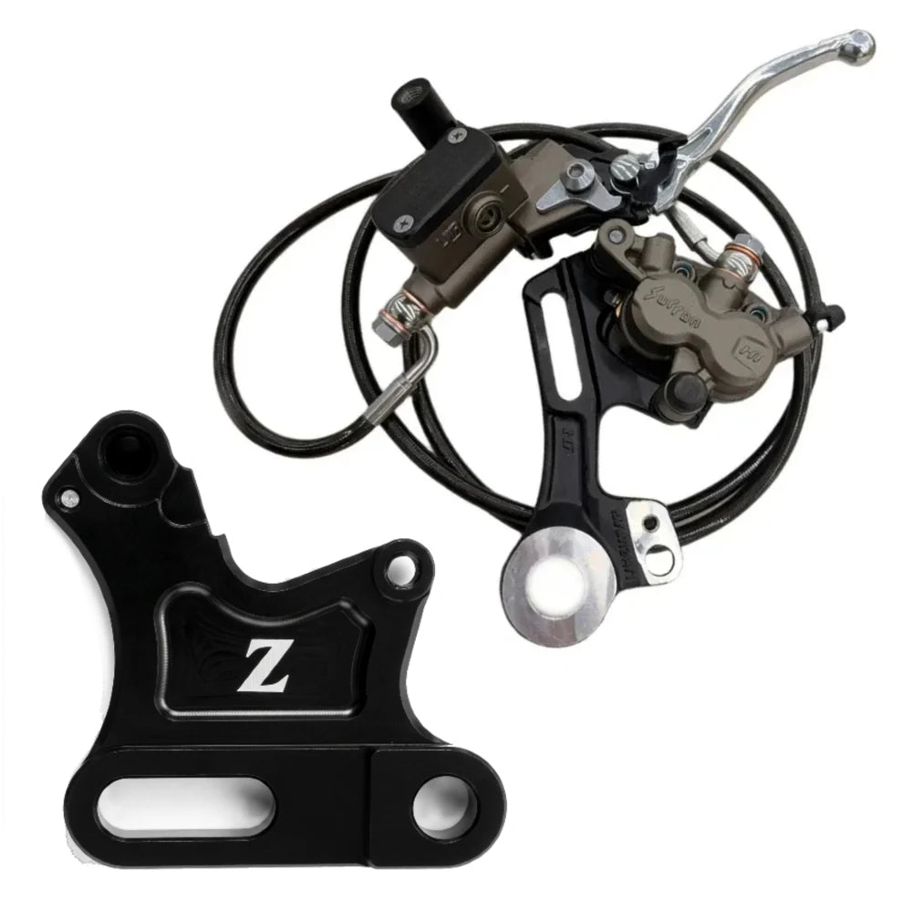 ETM RTR Ultra Bee brake kit, black Z caliper bracket beside a Surron logo caliper on a black hanger, braided brake line