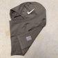 Nike Pro Therma-FIT Hood folded, showing swoosh detail