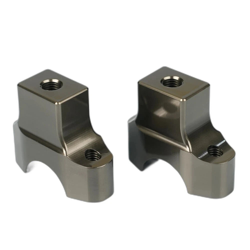 CNC bar clamp risers for the Pure Traxion triple clamp