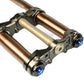 Pure Traxion top crown with blue adjusters on the stanchions for Surron Ultra Bee