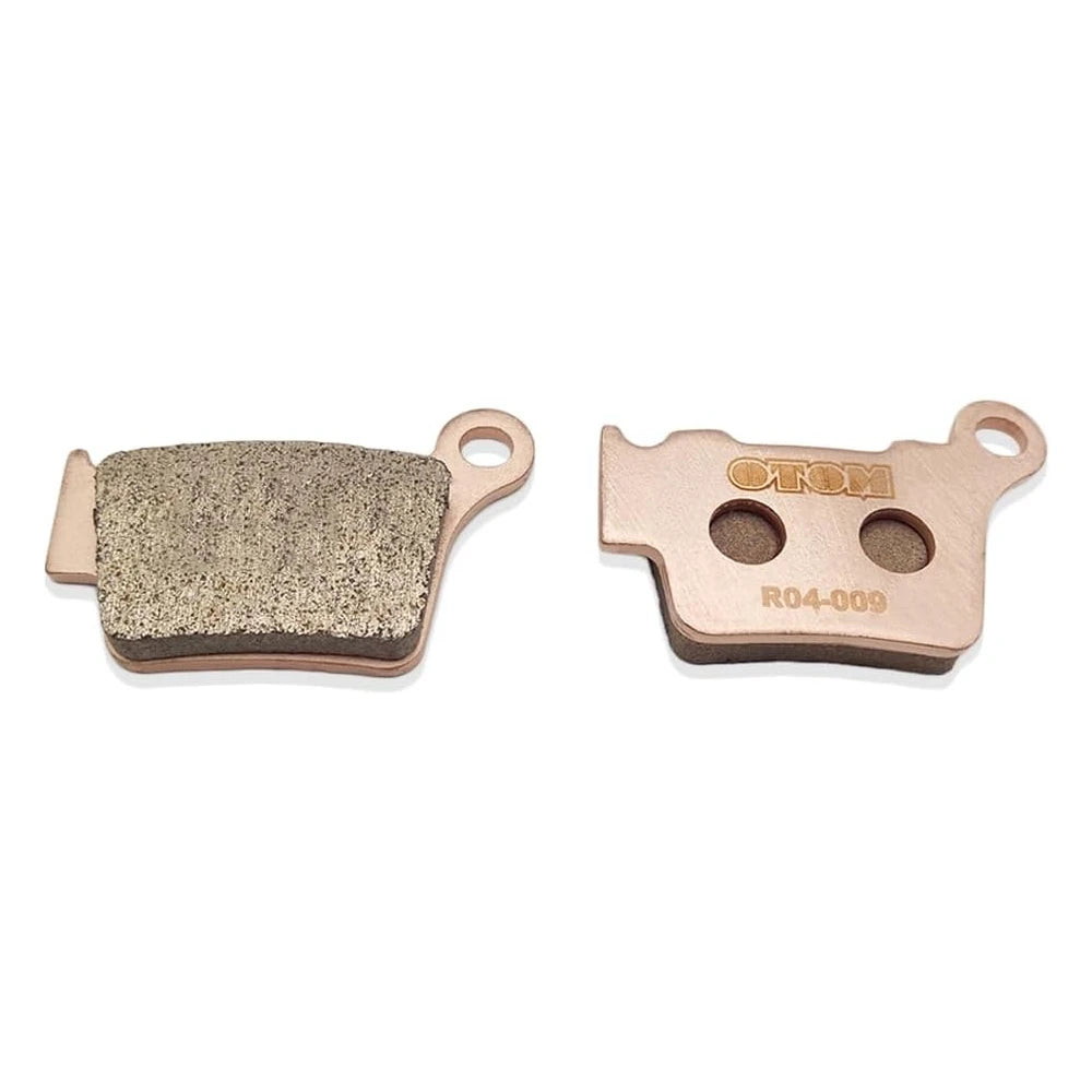 Stark Varg brake pads, rear R04-009 set laid flat, one pad showing its friction face and one showing the backing plate