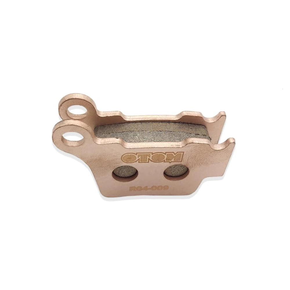 Stark Varg brake pads, rear R04-009 set close-up at an angle, two pads stacked with friction material between them