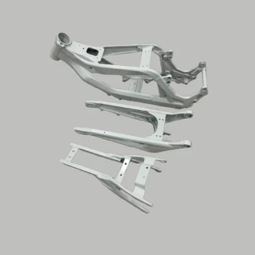 Side view of white Sur-Ron Light Bee X frame kit showing weld details and geometry
