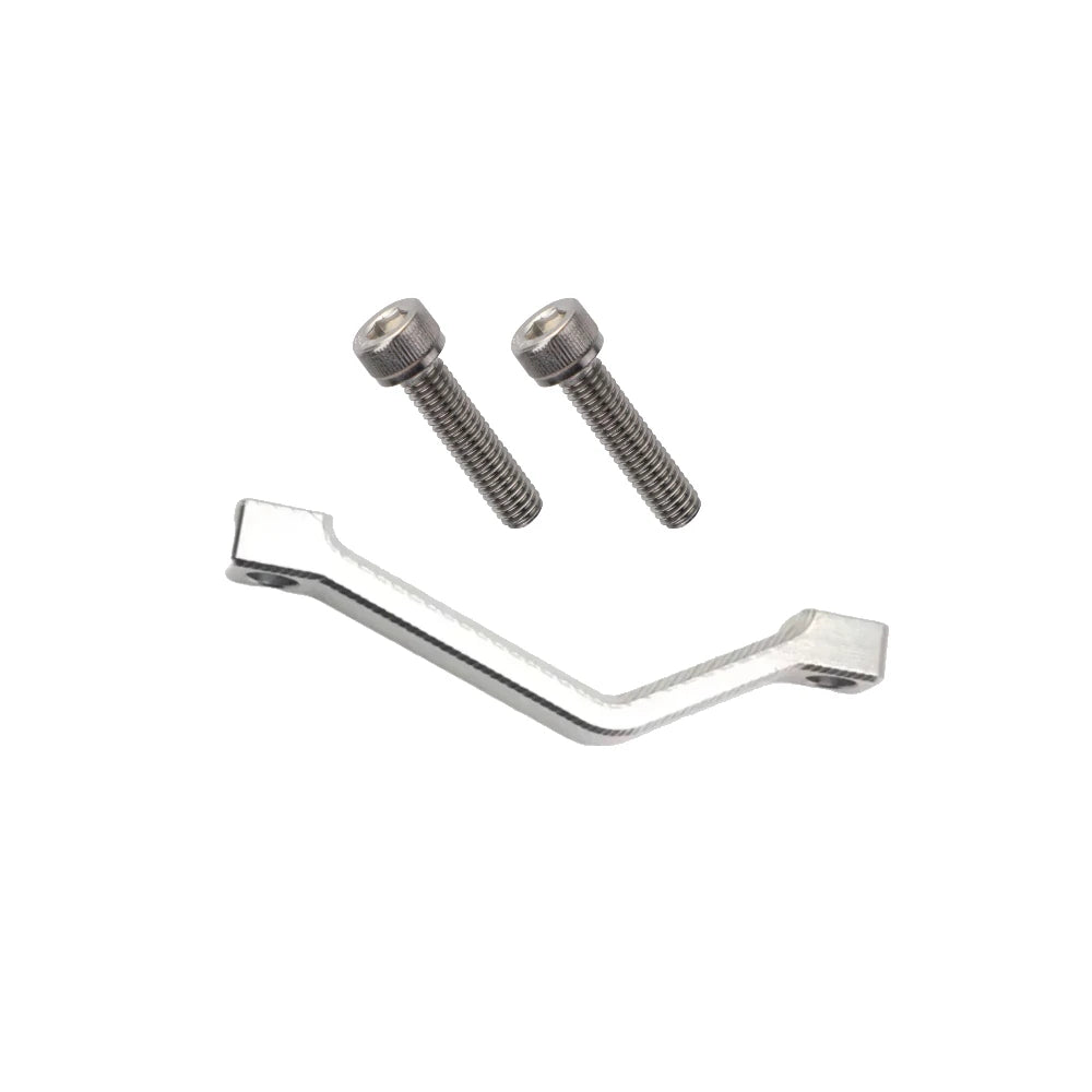 Silver 220mm Surron caliper spacer mount, with bolts