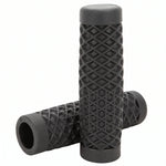 Surron grips in black waffle pattern, one grip standing on the other to show the open bore and knurled ends