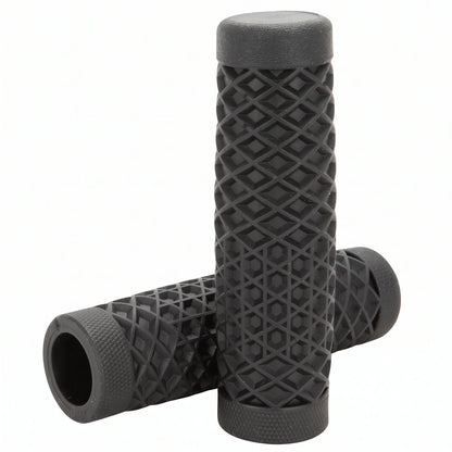 Surron grips in black waffle pattern, one grip standing on the other to show the open bore and knurled ends