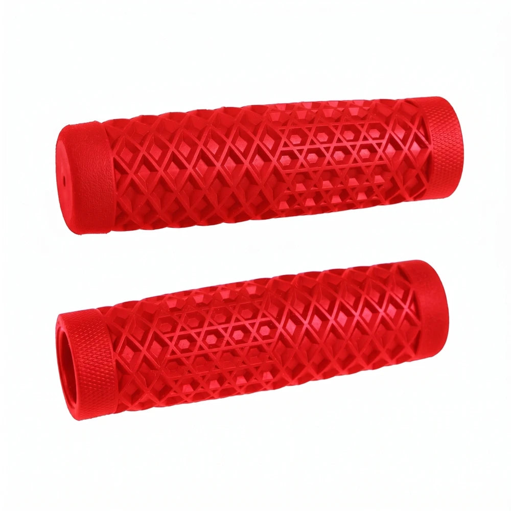 Surron waffle grips in red, pair laid side by side showing the diamond and hex pattern on white