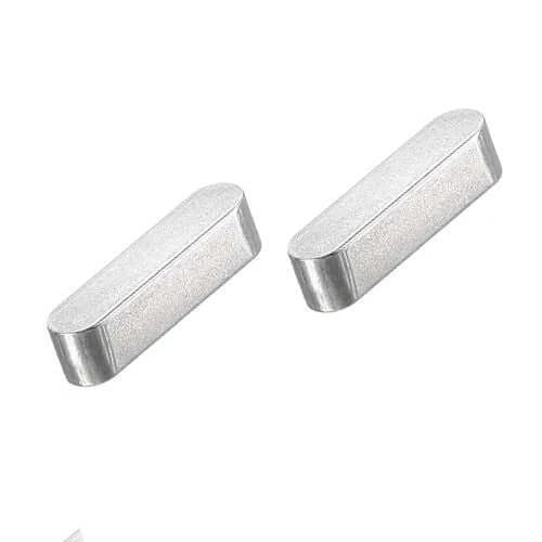 2 pieces of the steel surron motor woodruff key on a white background