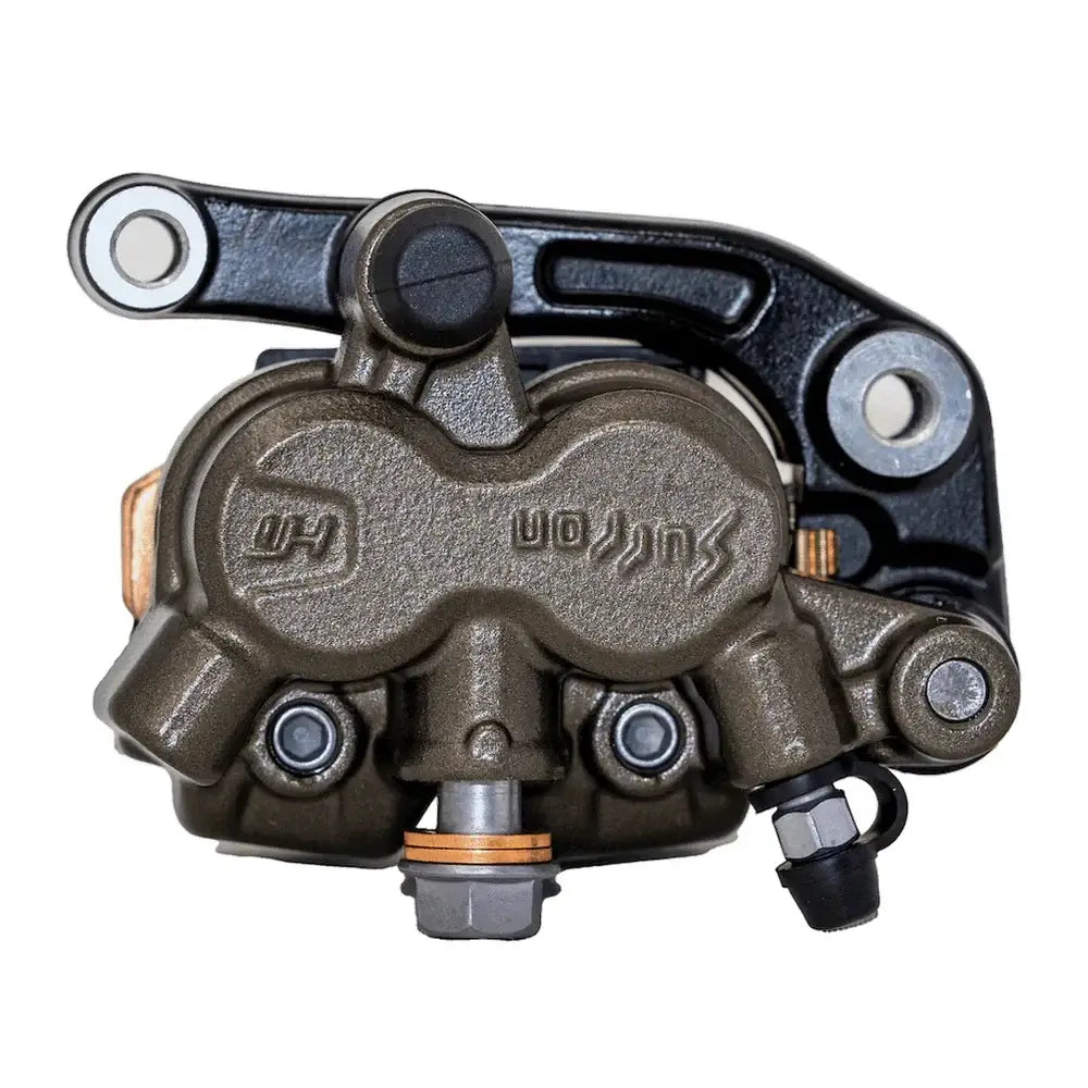 Surron Ultra Bee front brake caliper, embossed Surron logo with black mounting bracket and bleeder valve, upside-down view