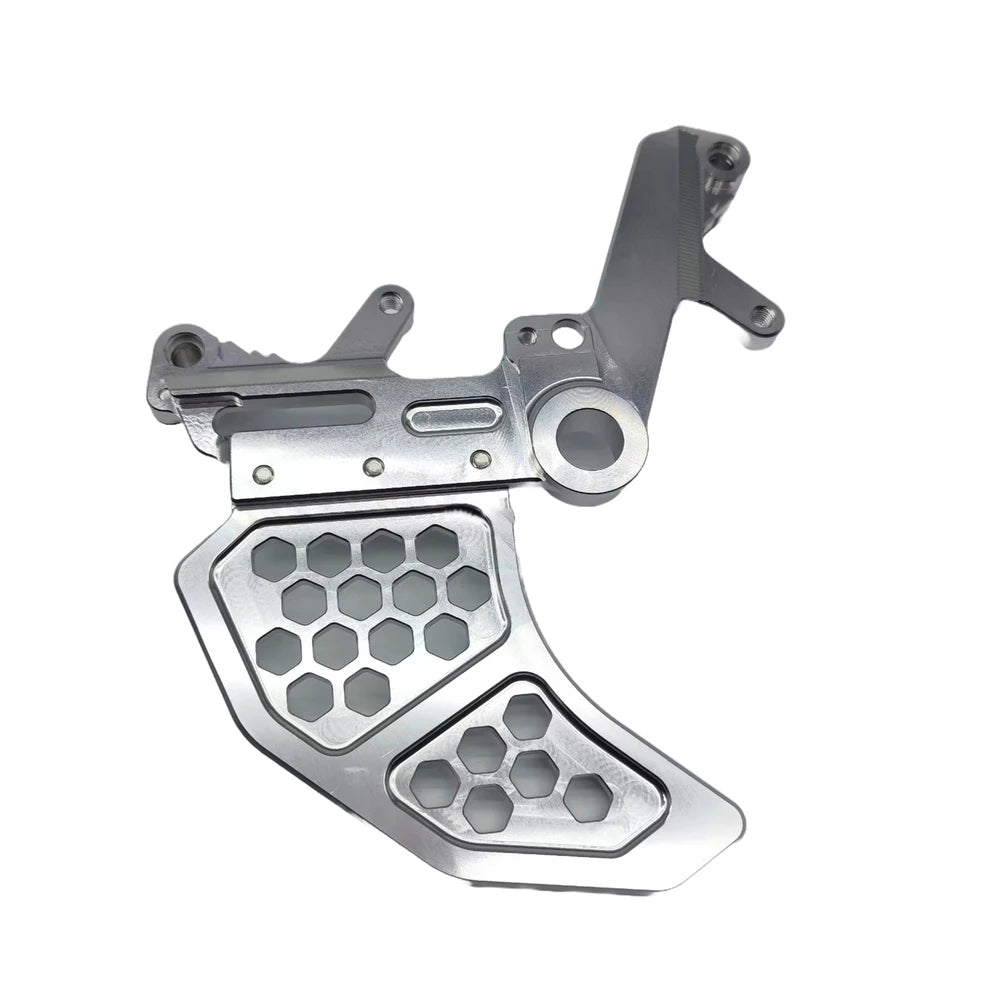 Silver Surron Ultra Bee dual caliper bracket for foot brake kit installation