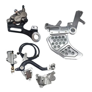 Surron Ultra Bee foot brake kit in silver with dual caliper bracket, rear caliper, master cylinder, and pedal assembly