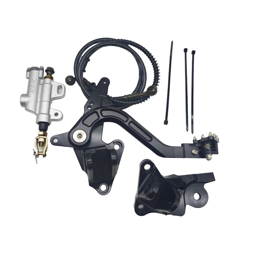 Upgraded Surron Ultra Bee V2 foot brake system with billet pedal, master cylinder, and mounts in black