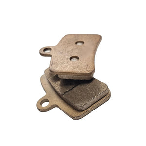 Rear plate detail of Talaria MX5 copper sintered brake pads showing twin locator holes for easy installation.