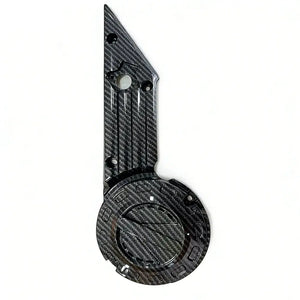 Talaria X3 carbon fiber left side cover, glossy twill-weave finish with circular badge cutout and mounting holes