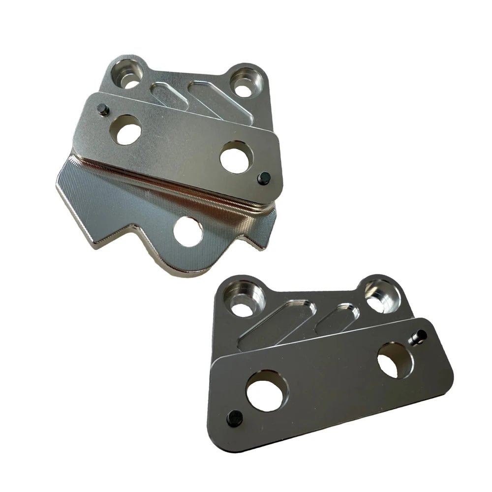 Silver CNC‑machined left and right foot peg brackets for Talaria XXX/X3 bikes, durable 6061 aluminum set