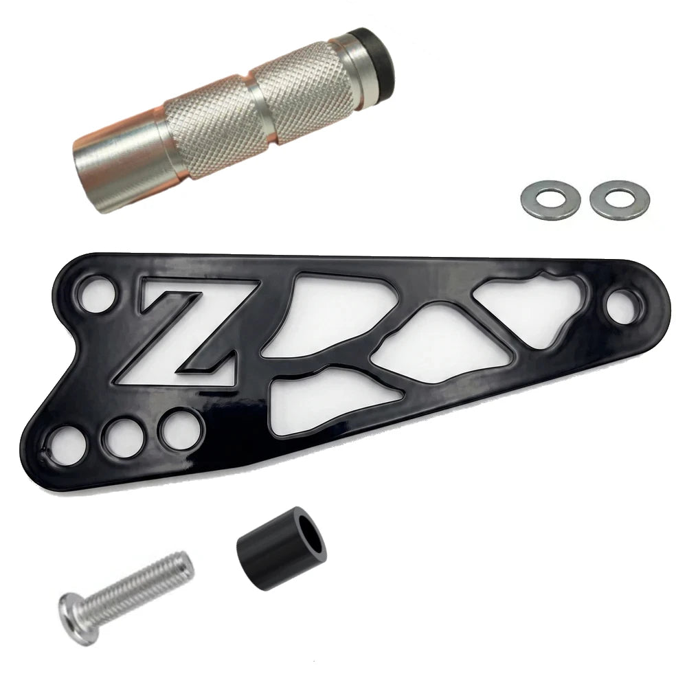 Talaria XXX shift lock kit, black anodized CNC bracket with cut-out Z logo, knurled aluminum peg, washers and bolt hardware