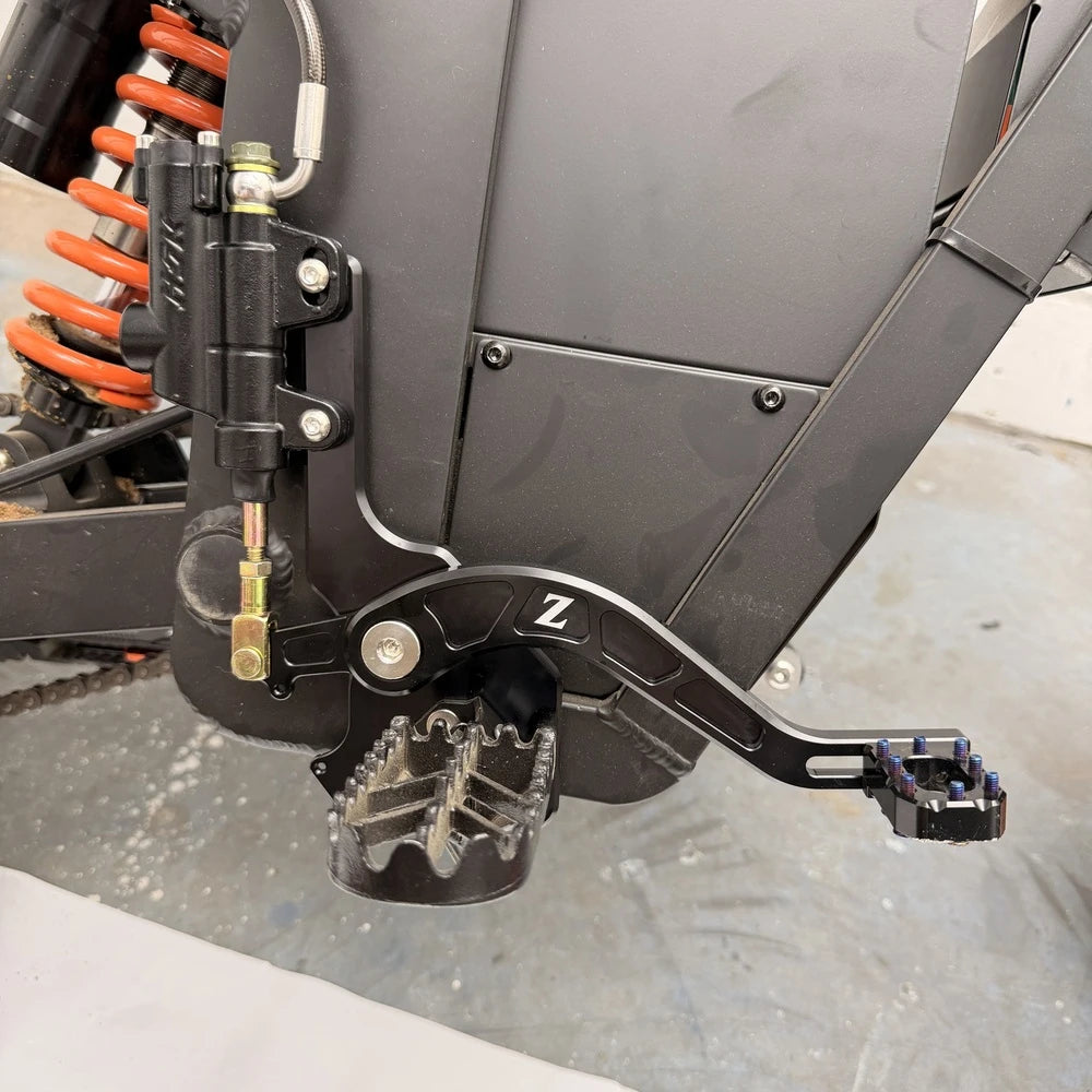 Close-up of the Tuttio foot brake bracket and lever installed on a Soleil 01 frame