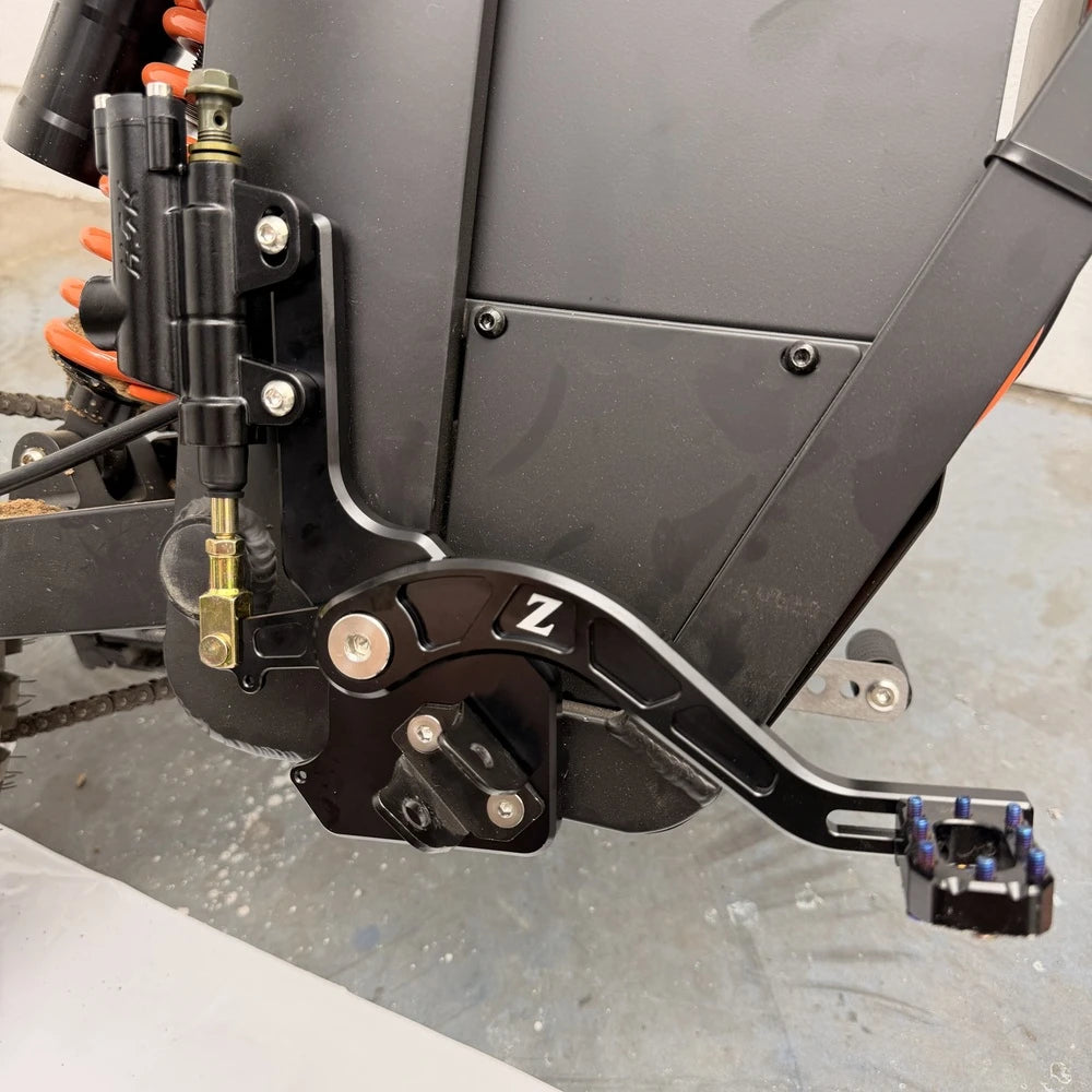 Side view of the Tuttio foot brake kit installed on a Soleil 01 with pedal extended