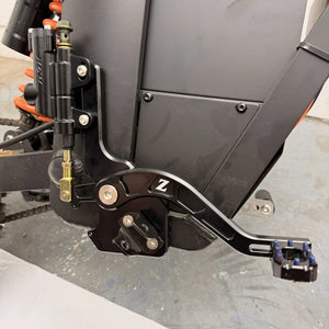 Side view of the Tuttio foot brake kit installed on a Soleil 01 with pedal extended