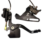 Tuttio Soleil 01 foot brake kit, wide black caliper bracket, OEM Surron Ultra Bee caliper and steel-braided line
