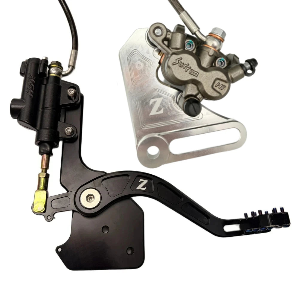 Tuttio Soleil 01 foot brake kit, silver caliper bracket, OEM Surron Ultra Bee caliper and steel-braided line