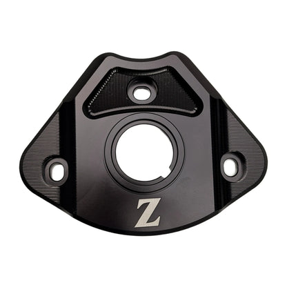 Yozma IN 10 aluminum ignition cover in black, front view with key opening, engraved Z logo and mounting holes