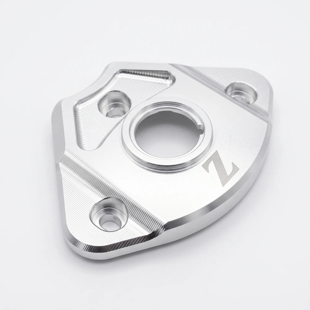 Yozma IN 10 ignition cover in silver aluminum, angled close-up of the key opening ring and knurled edges