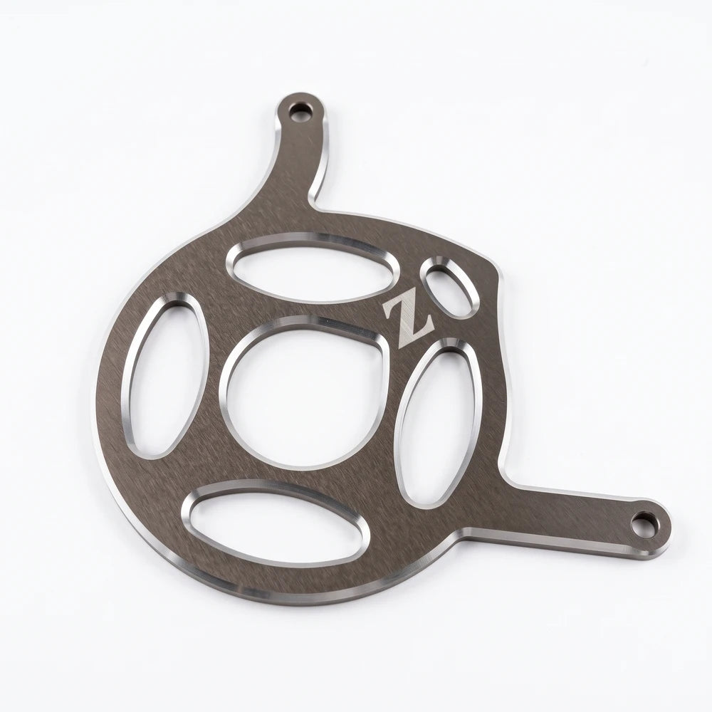 Yozma IN 10 motor cover in silver, angled view of the oval cutouts, center opening and engraved Z logo