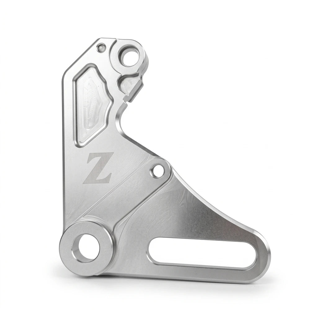 Yozma IN 10 brake bracket, silver version with a pocketed upper face and engraved Z logo, studio shot