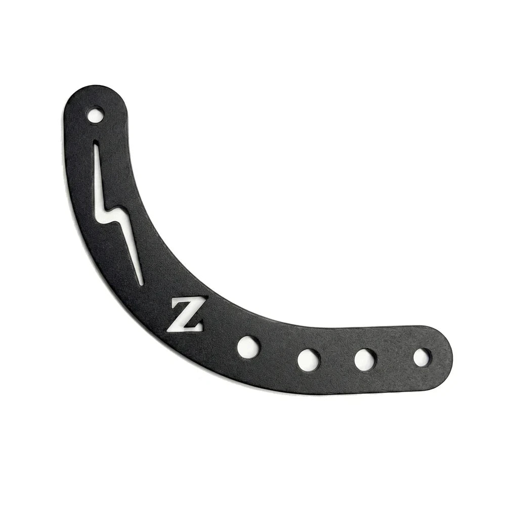 FactoryZ Yozma IN 10 shift lock bracket, curved matte-black aluminum with lightning-bolt cutout, engraved Z logo and adjustment slots